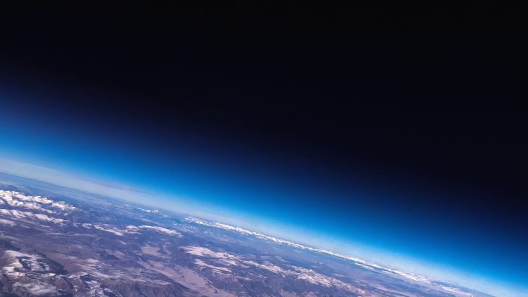 CISopto - Earth from space GNSS Positioning photo. Photo by ActionVance on Unsplash